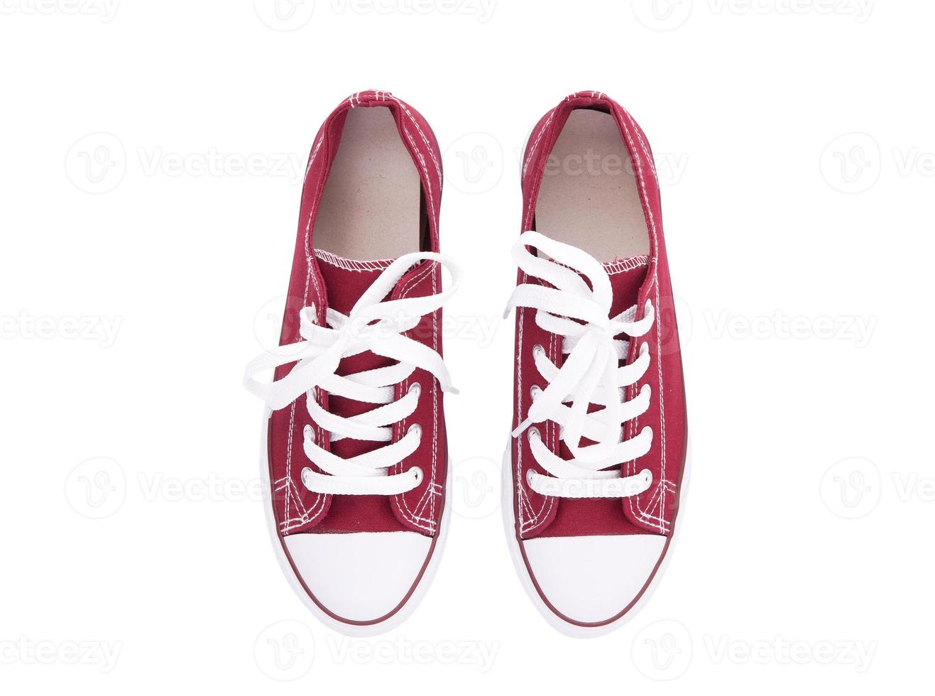 Red sneakers top view isolated on white background photo