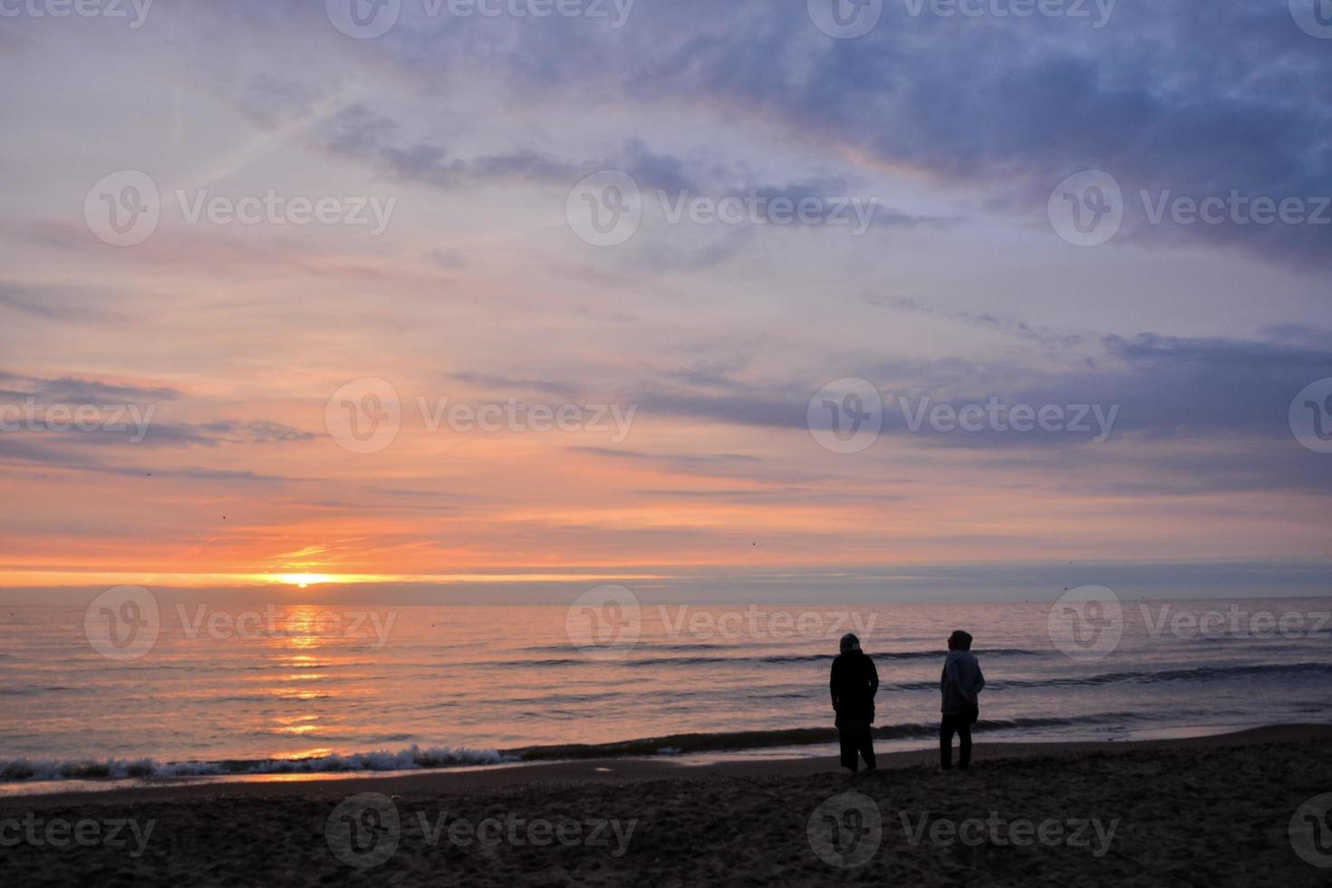 Sunset over the ocean photo