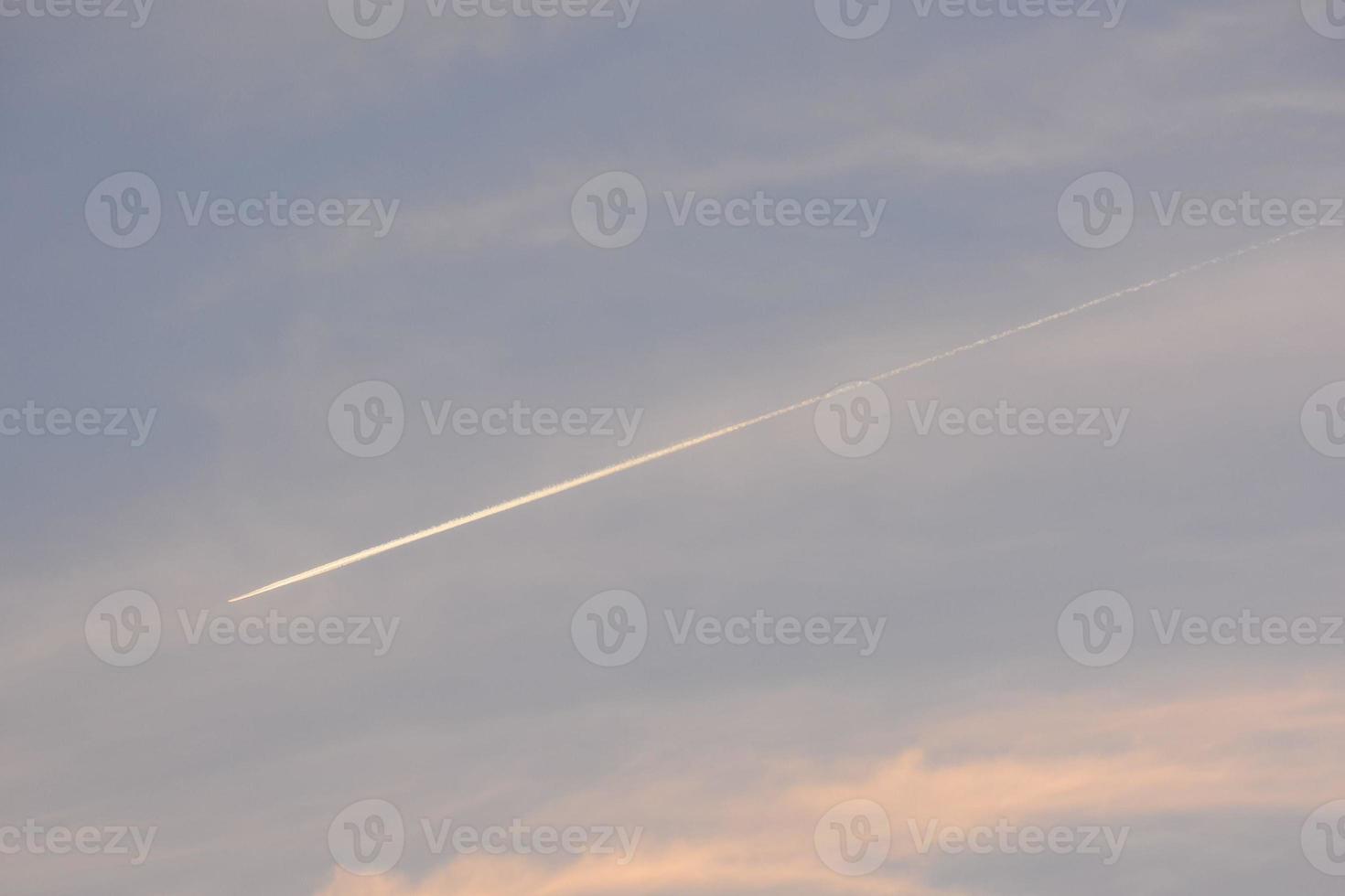 Contrails in sky photo