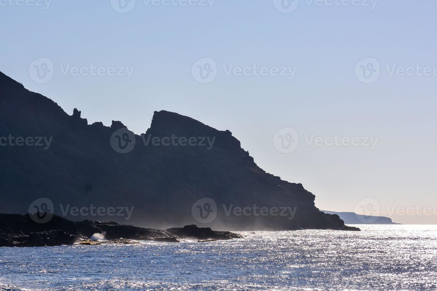 Waves hitting a rock scene 14594028 Stock Photo at Vecteezy