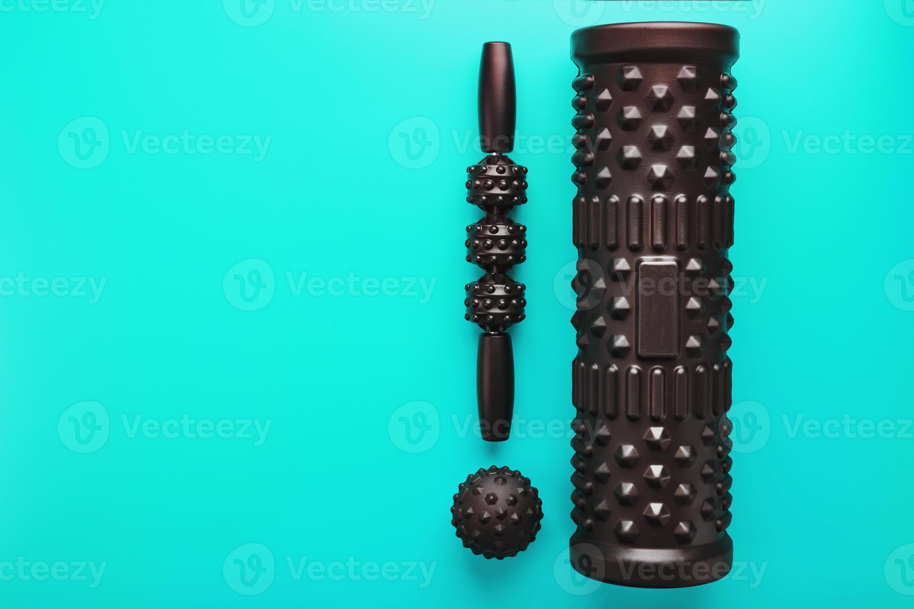 A set of black bumpy foam massage rollers, body rollers, rubber balls