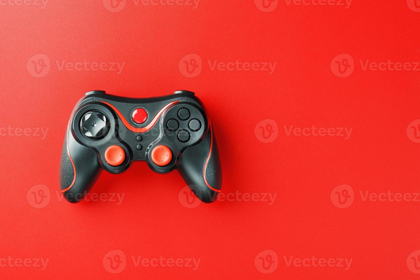 Game controller controller on red background. Device to control and control the game. photo