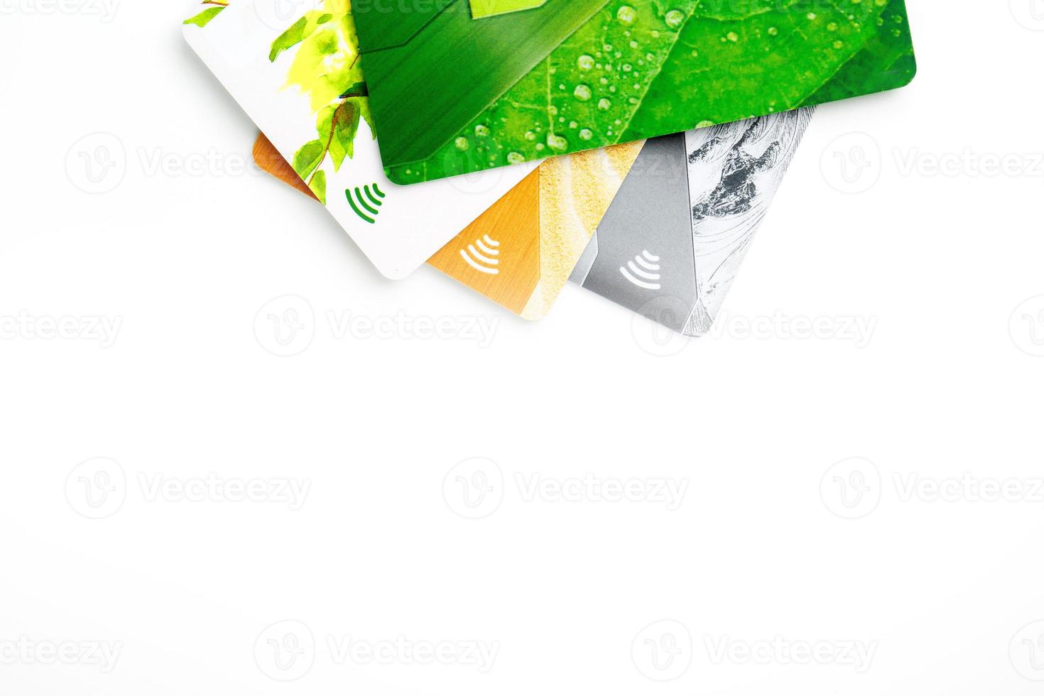 Credit cards with contactless payment. Pile of credit cards on white isolated background photo