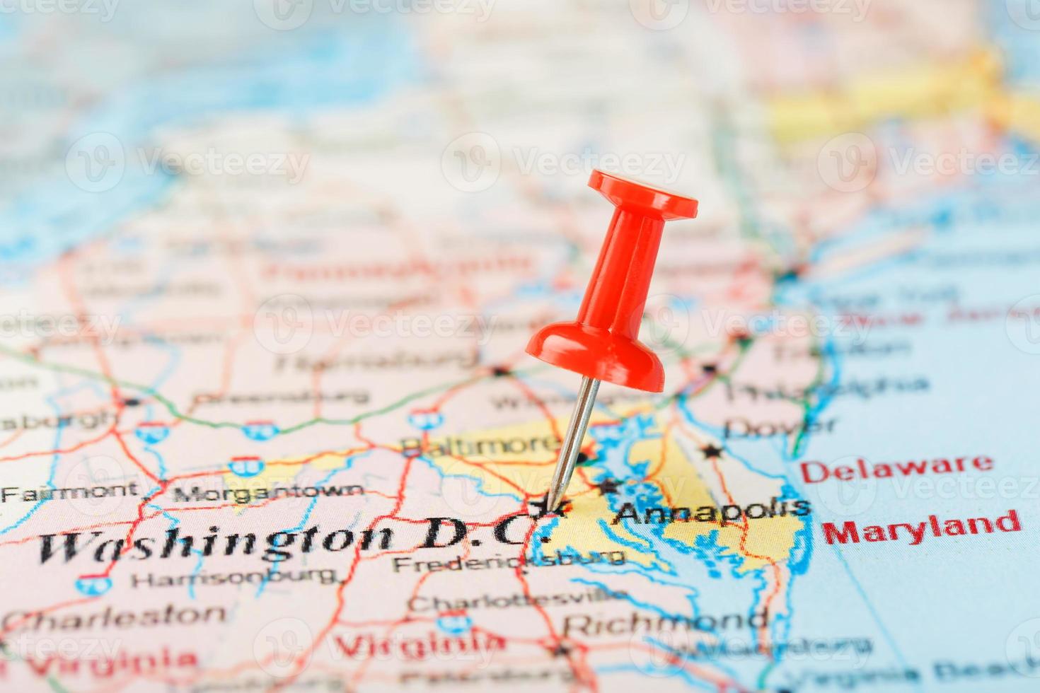 Red clerical needle on the map of USA, South Washington, DC and the capital of Richmond. Close up map of DC with red tack photo