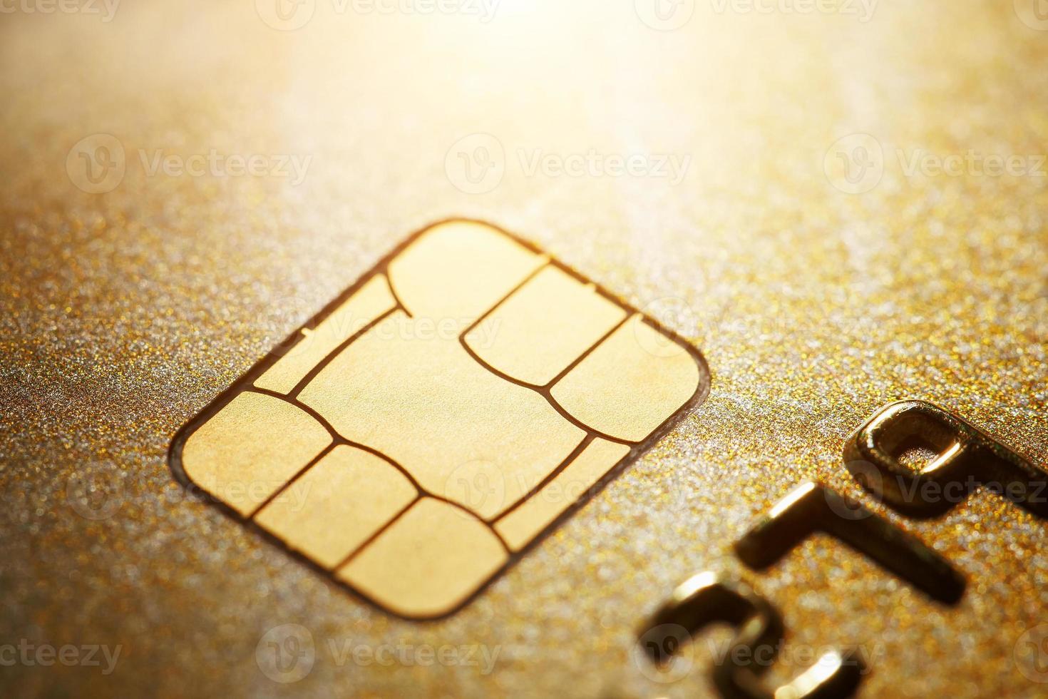 Gold credit card with micro chip selective focus photo