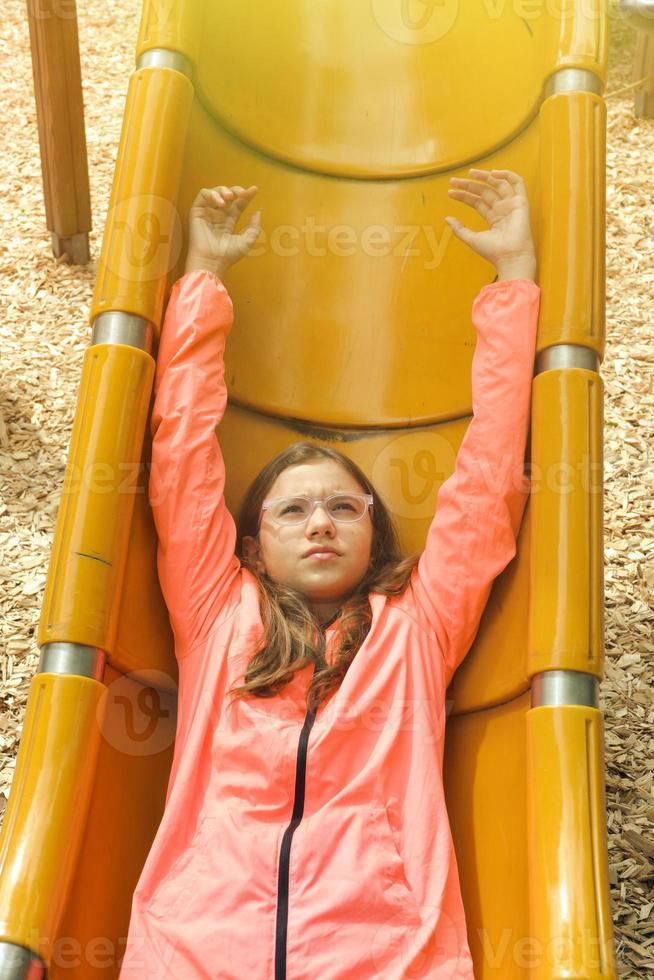 Teenage Girl is Having Fun in the Playground photo