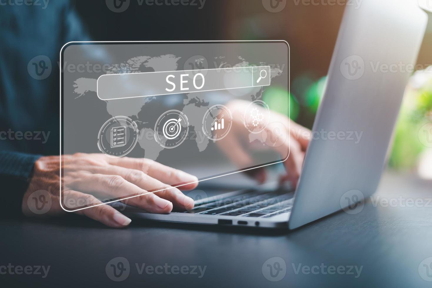 Marketers use laptops to analyze SEO, optimization analytics tools concepts. search engine ranking Social media sites based on results analytics data, effective keyword selection. photo