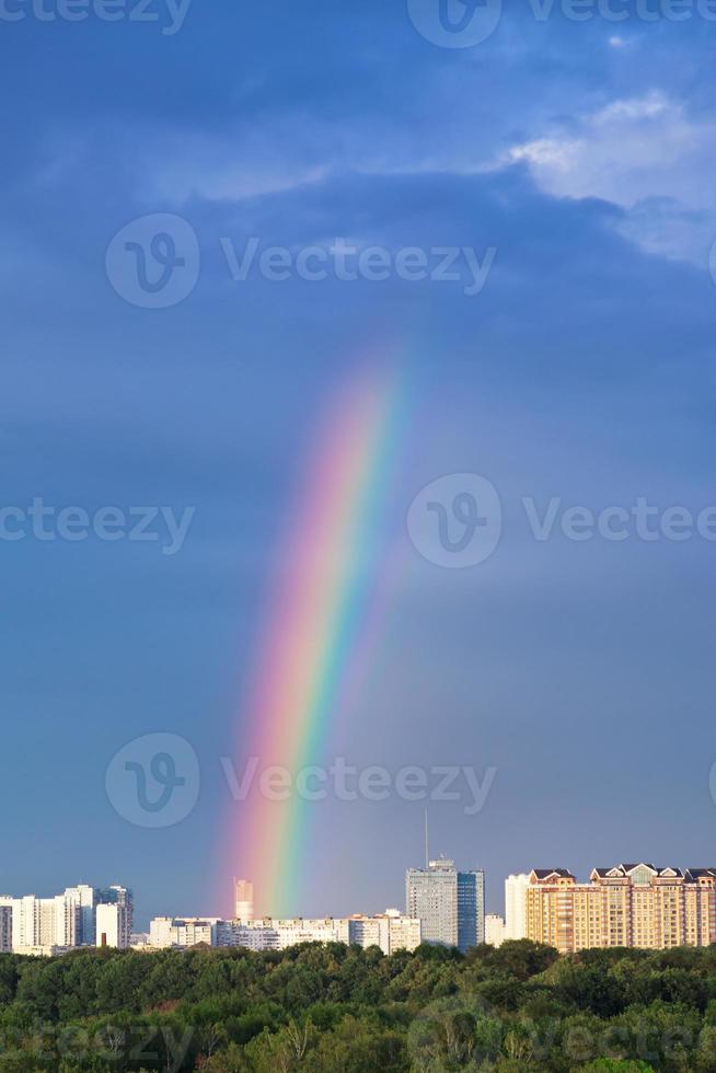 rainbows under city photo