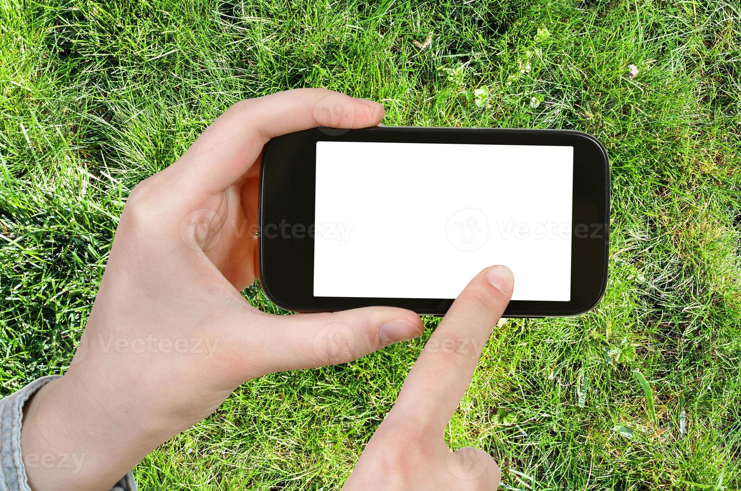 farmer photographs green grass of lawn photo