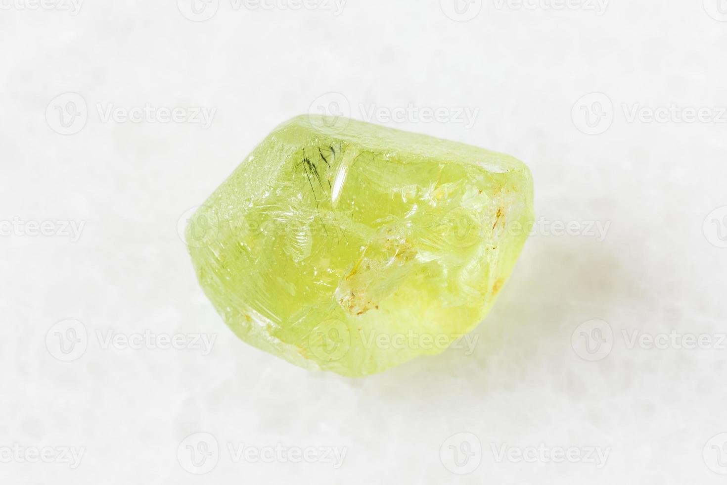 rough Olivine Peridot, Chrysolite on white photo