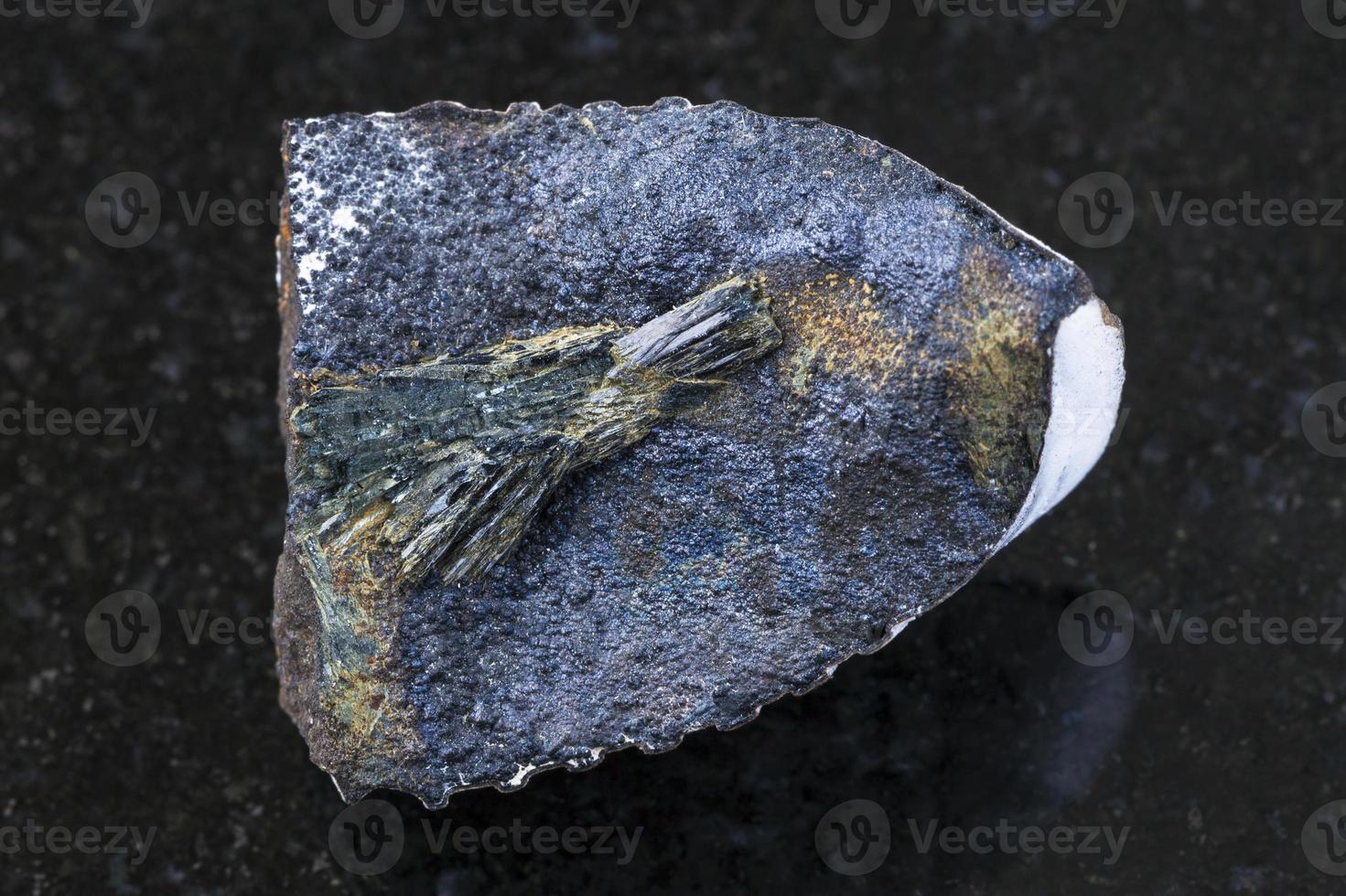 raw Vivianite stone on dark background 14611217 Stock Photo at Vecteezy