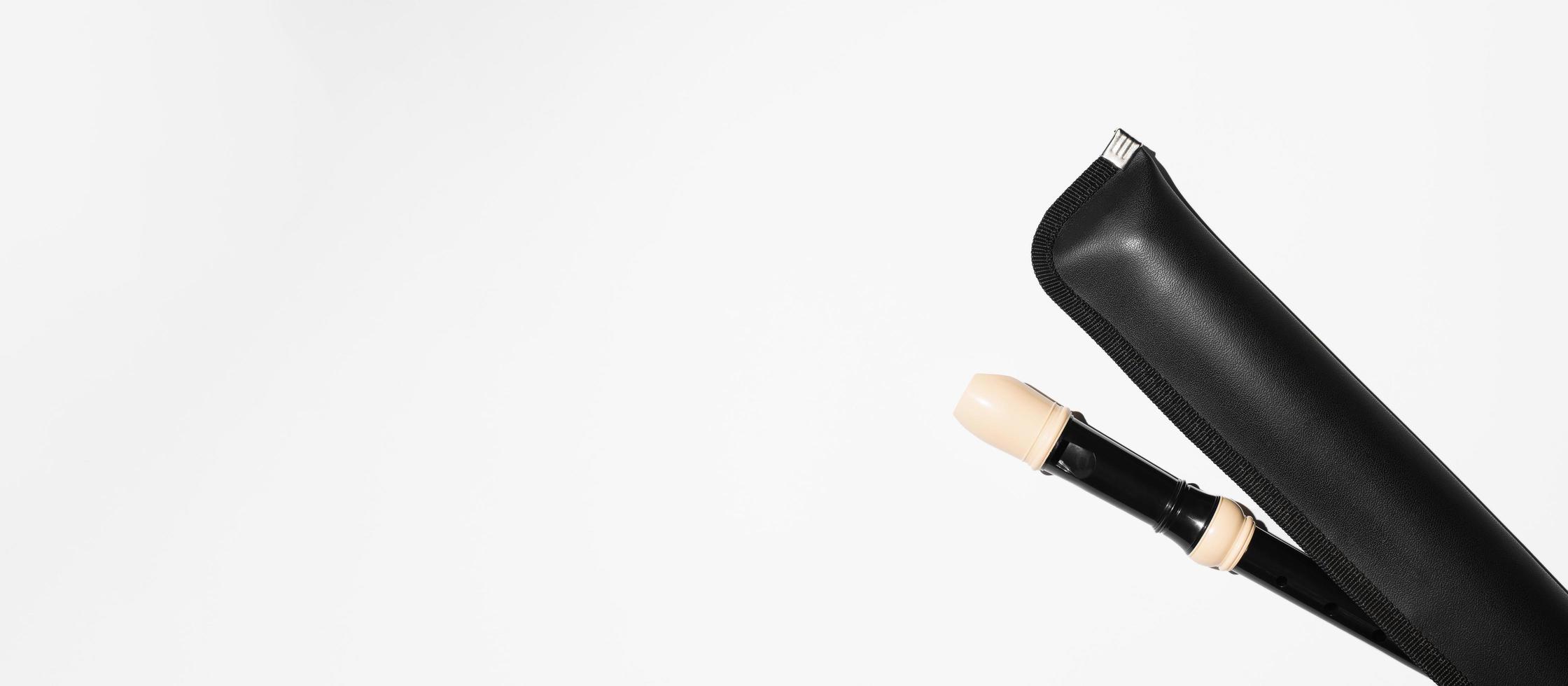 Musical flute in a black leather case, top view. Banner, copy space photo