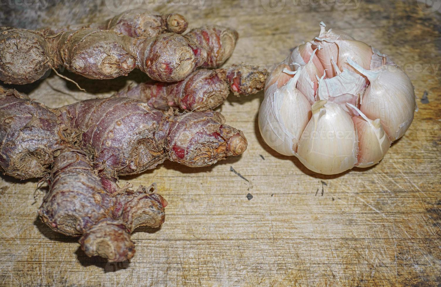 Red ginger on a wooden cutting board. selective photo of ginger spice on a wooden board