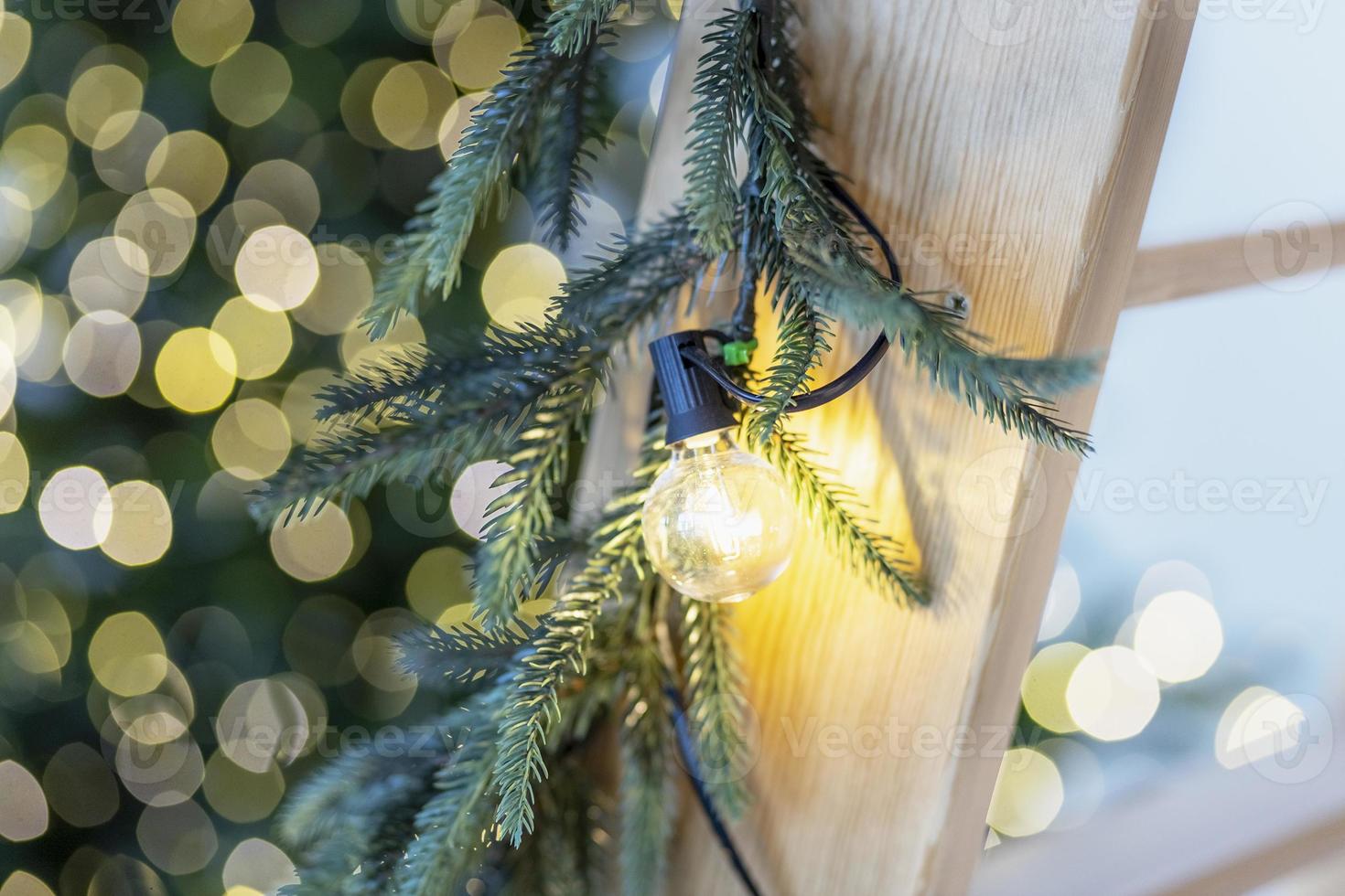 Christmas with fir tree and festive bokeh lighting, blurred holiday background photo
