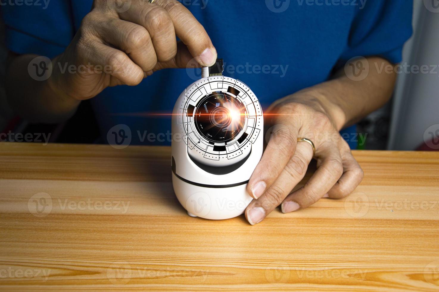Conceptual man operating ip camera photo