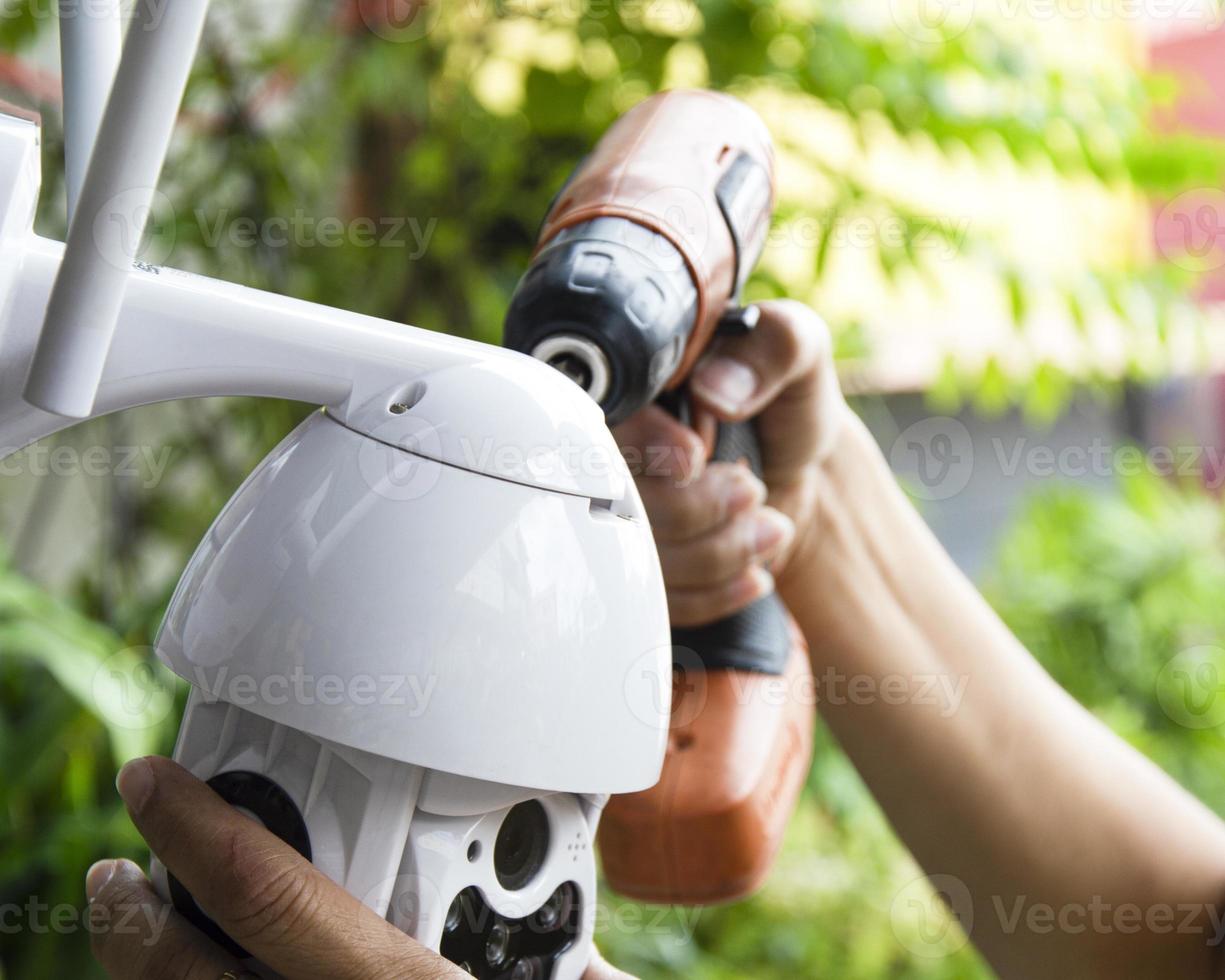 Man installing IP CCTV or high tech surveillance system CCTV system photo