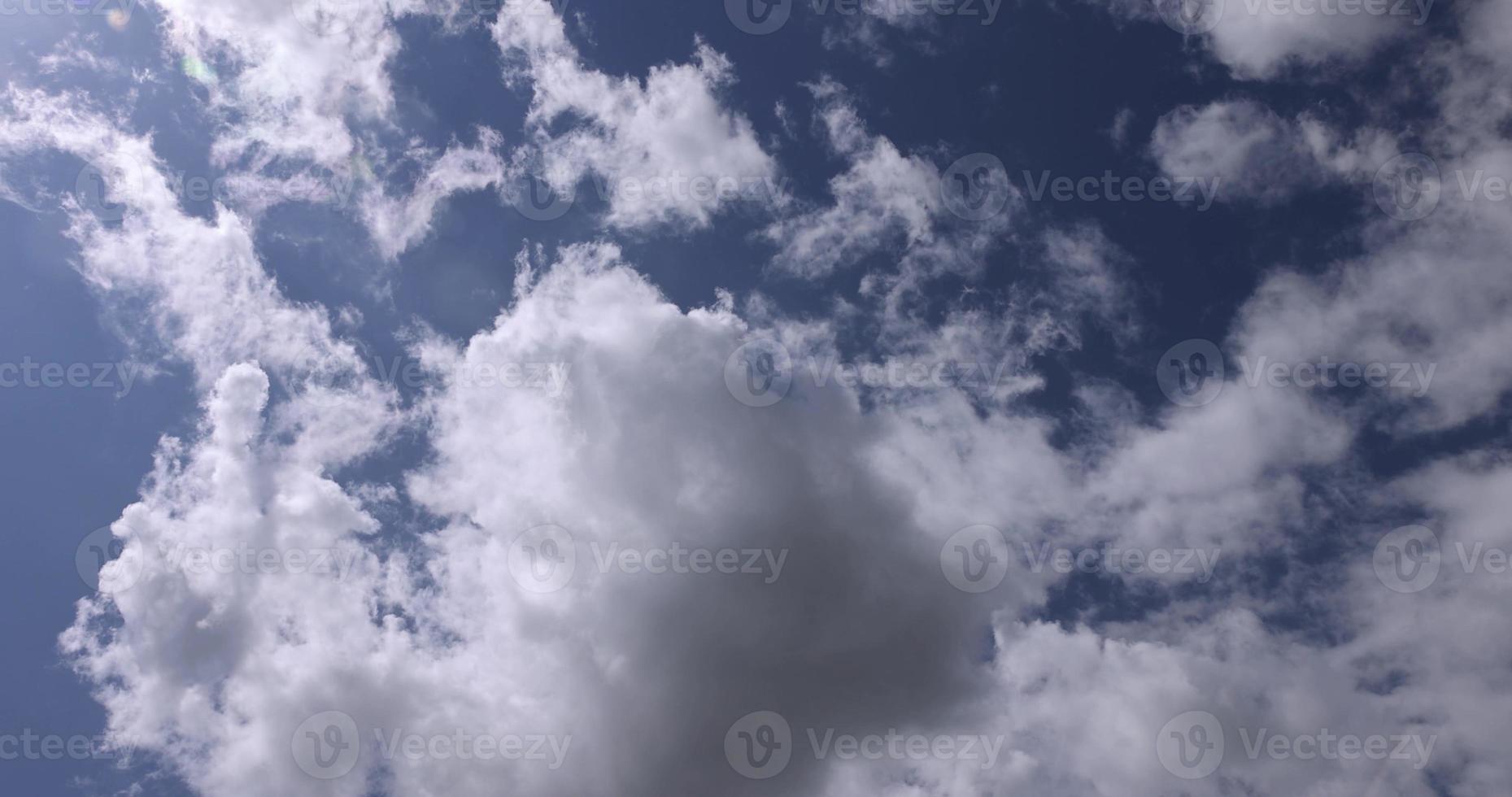 Clouds floating across the sky in the daytime photo