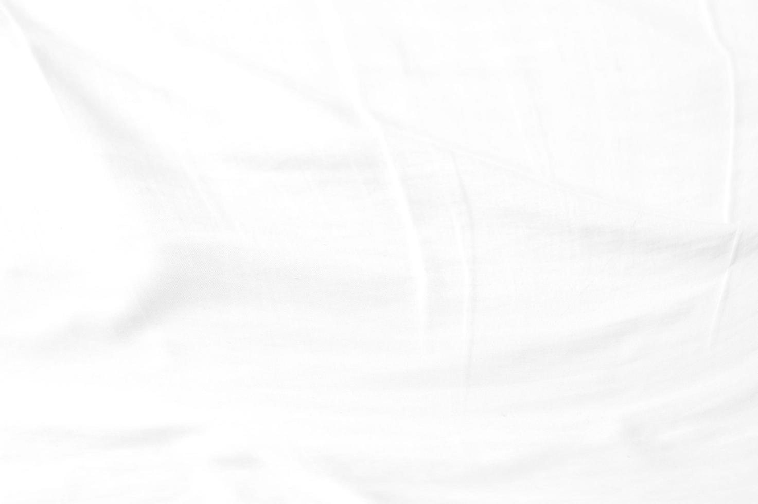 White crumpled cloth with the soft wave and  wrinkled texture background. photo