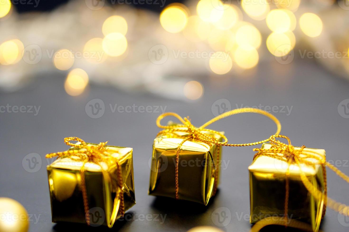 New Year or Christmas of gift box on black background, blurred background. photo