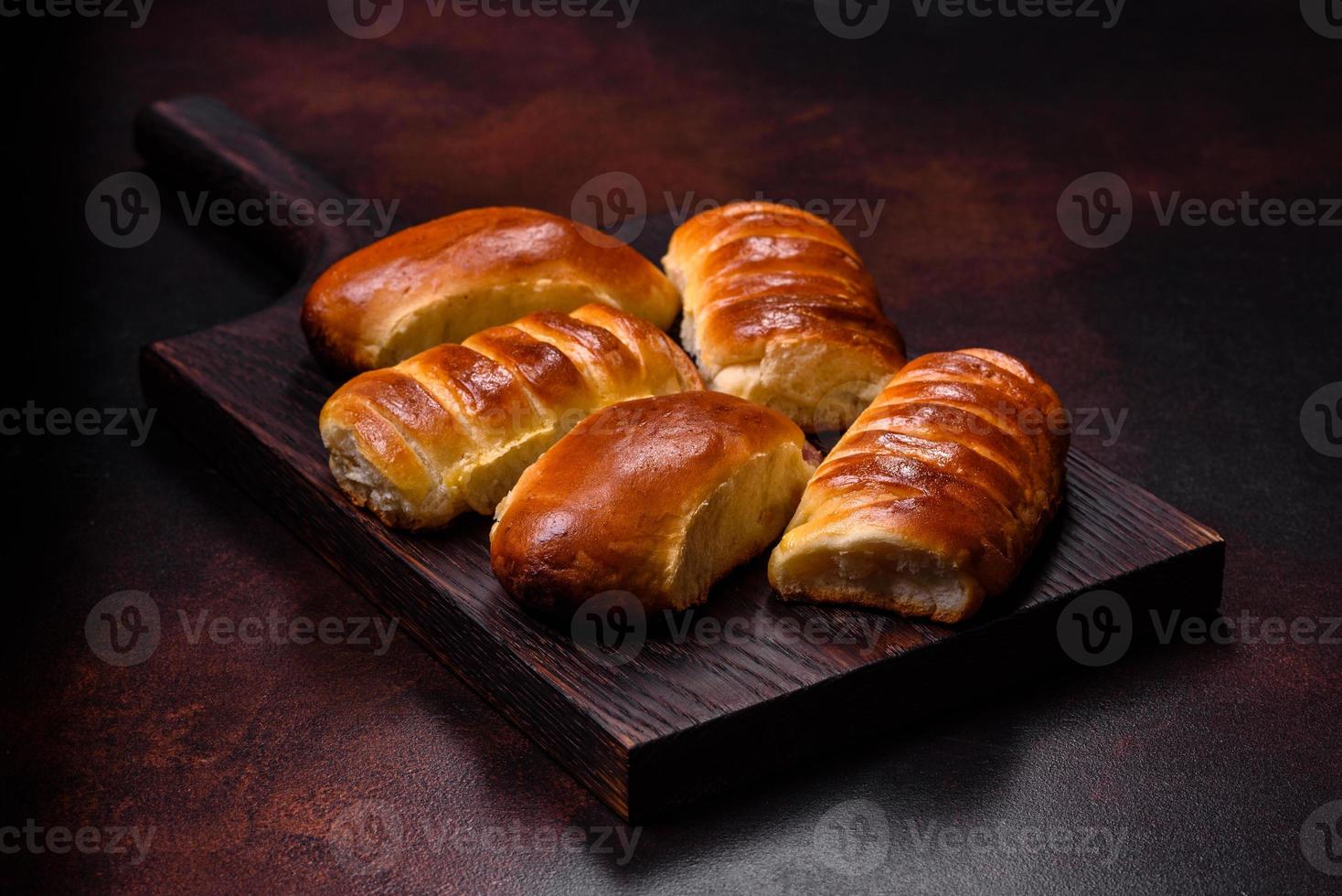Sweet tasty fresh festive baking on a dark concrete background photo