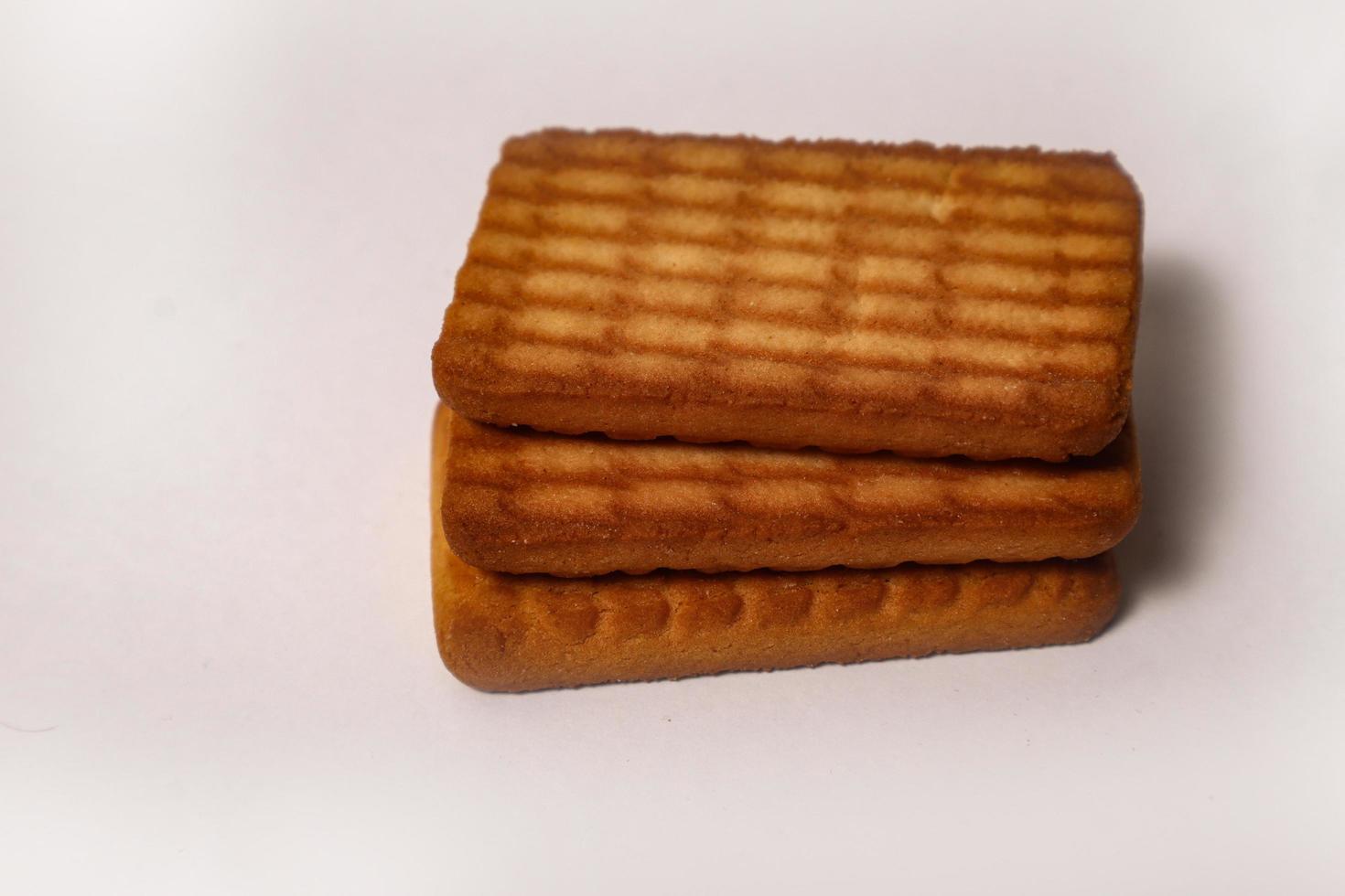 Wheat biscuits in the steel plate with blury background. Indian biscuits popularly known as Chai-biscuit in India photo