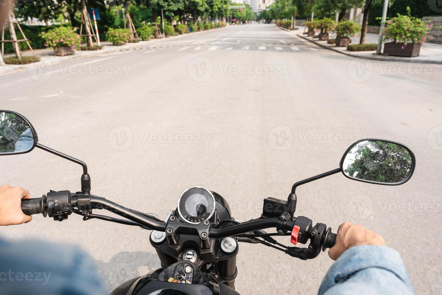 Image of Asian man driving on the street photo
