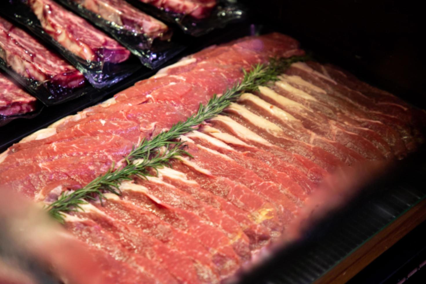 raw meat on the bench in the store photo