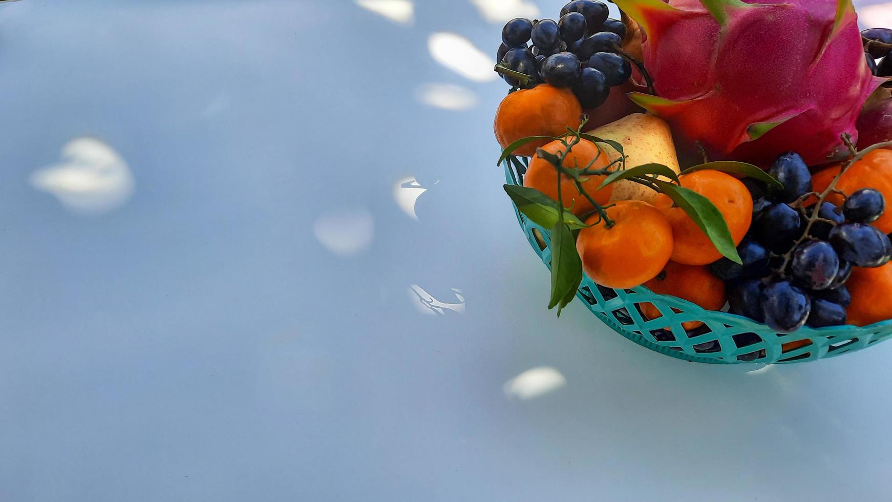 Tropical Dragon Fruit Oranges, pears, grapes on the right on a white background 04 photo