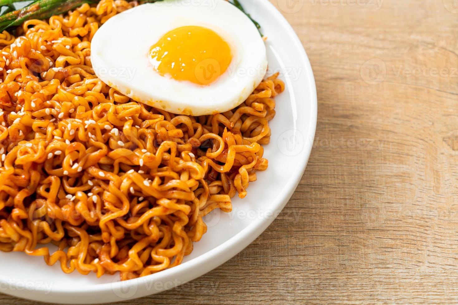 dried Korean spicy instant noodles with fried egg photo