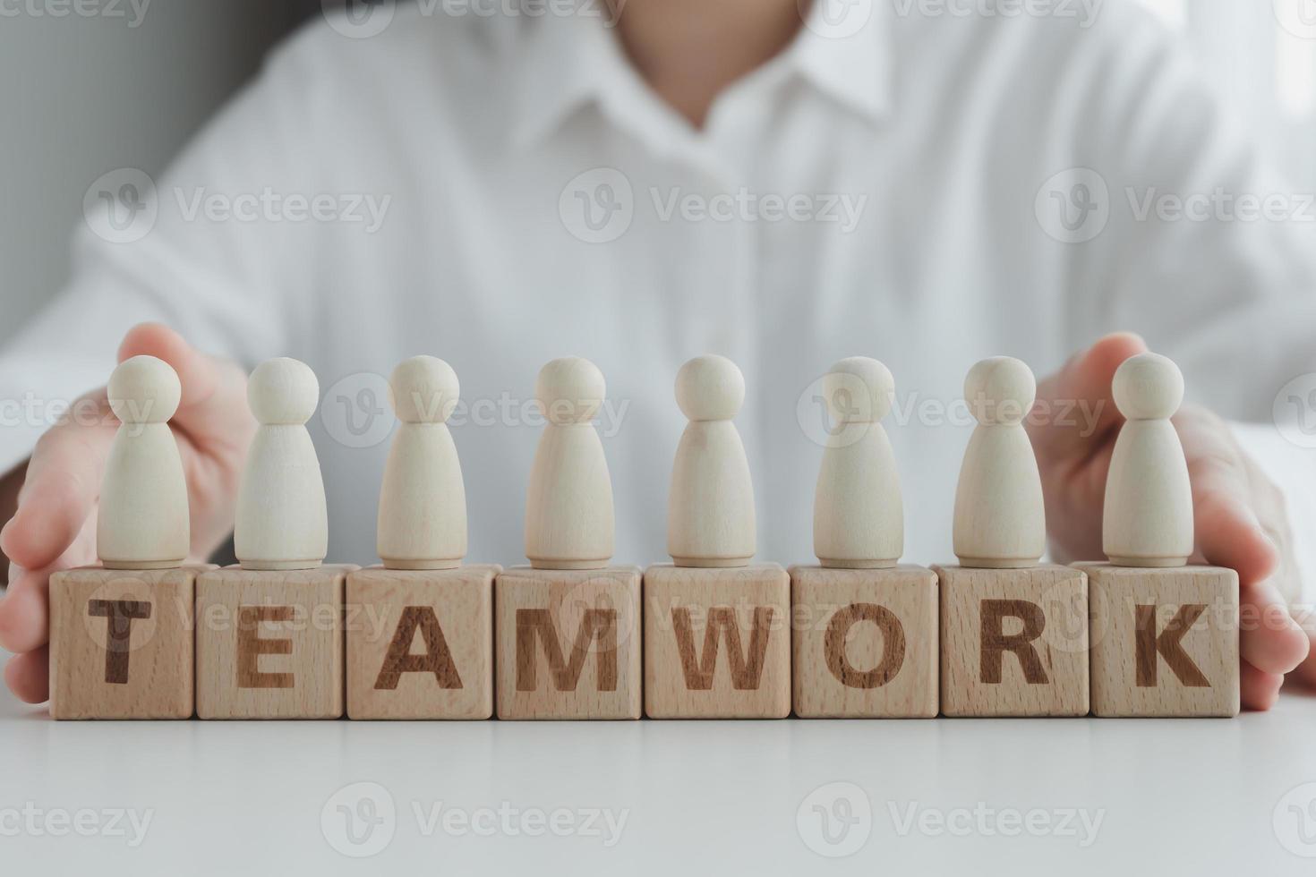 Teamwork. Business achievement goal and objective target. Team growing business success concept. Teamwork with team human figure stand on wooden block. photo