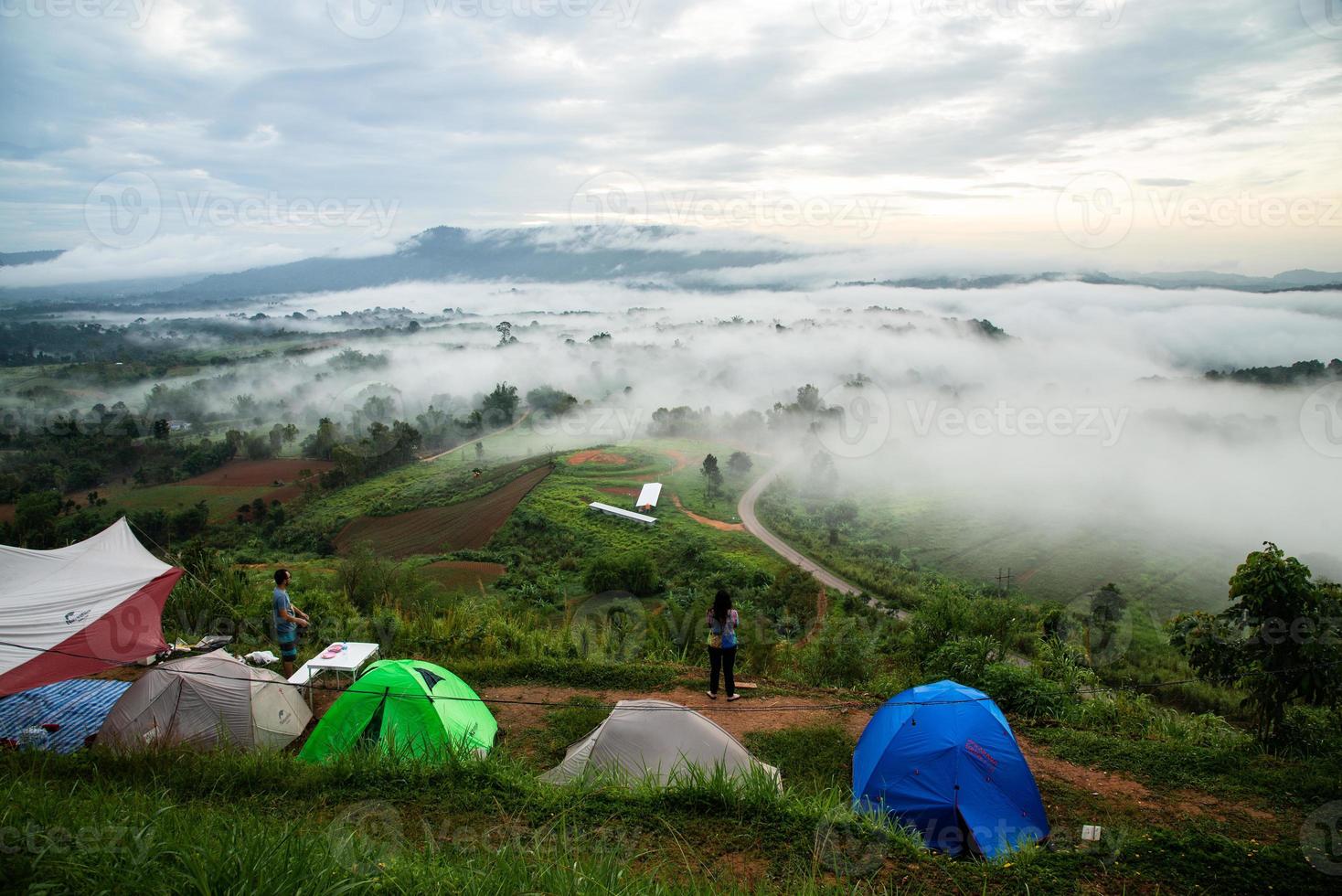 Phetchaboon, Thailand - June 23, 2018 Camping  tent near the fog and mountain seeing sunrise in the moring, Thailand photo
