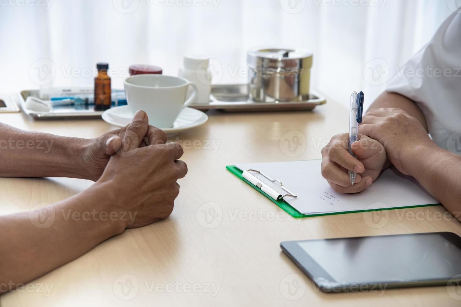 The doctor diagnos the patient' health in the hospital photo