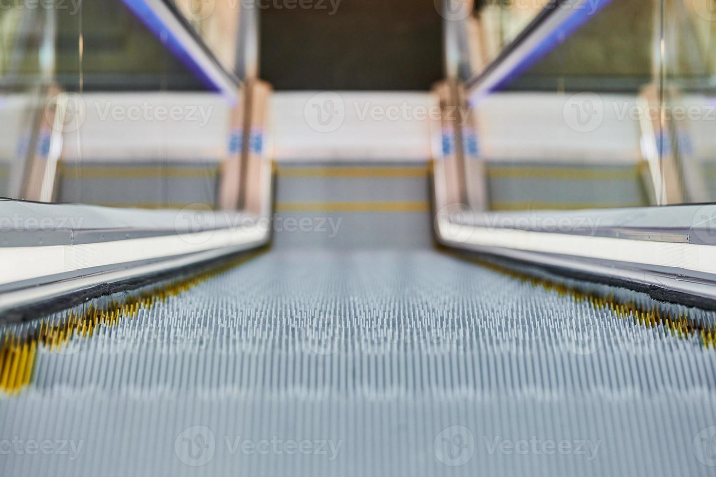 Escalator in shopping center photo