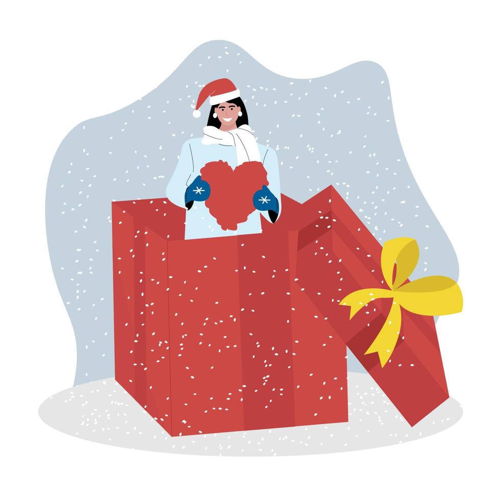 A girl in a Santa Claus hat climbed out of a gift box with a heart in her hands, and snow swirls around her. Vector illustration.