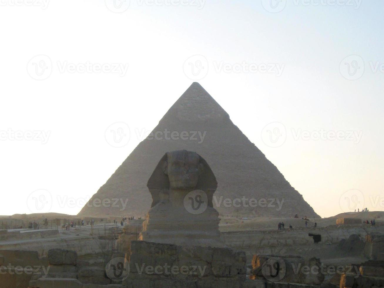 The statue of Sphinx and Pyramids Of Giza. Cairo, Egypt photo