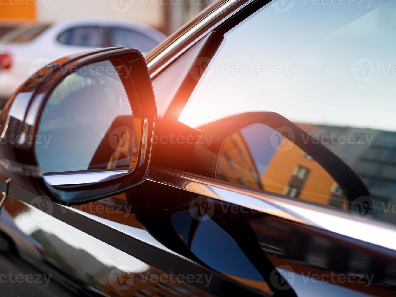 Anti-glare rearview mirror on a black car. photo