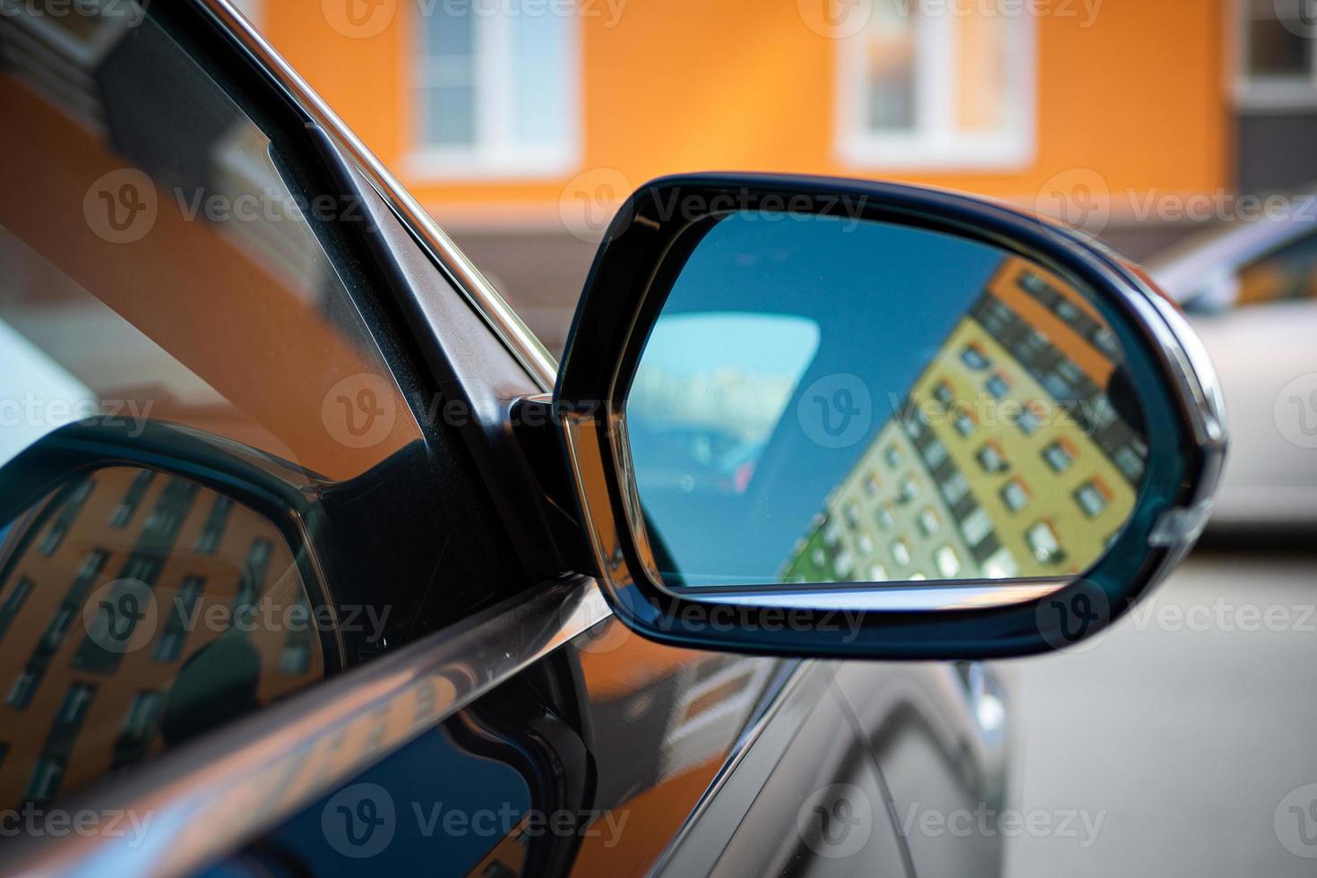 Anti-glare rearview mirror on a black car. photo