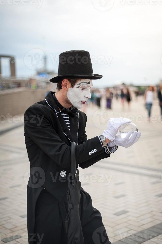 Mime on the street waiting to meet with his lover photo