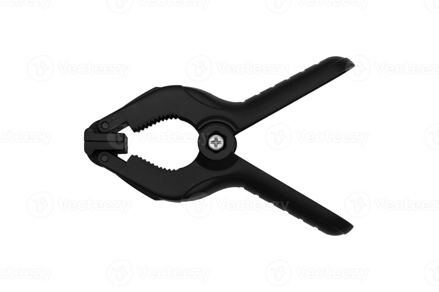 Black plastic clamp high angle view isolated on white background photo