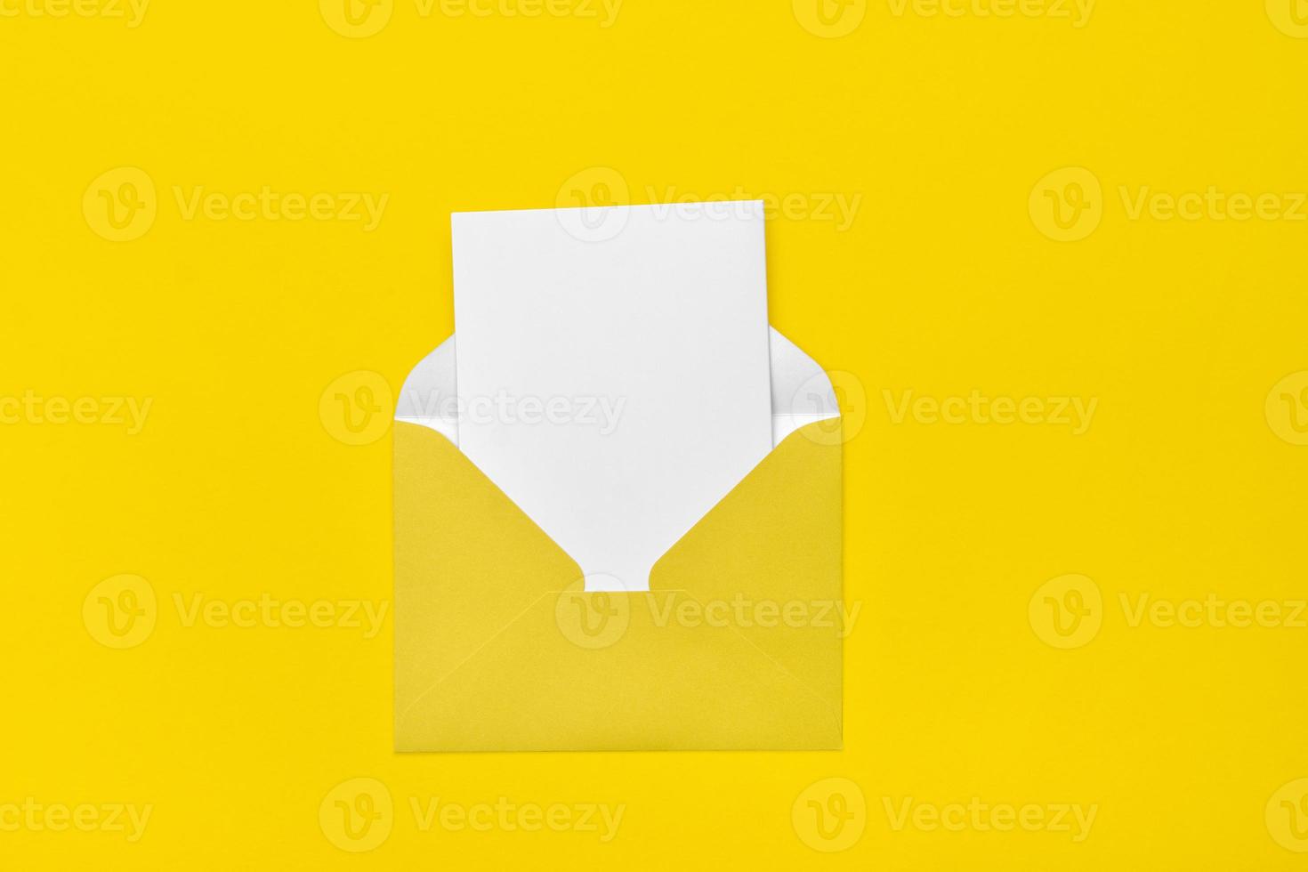 yellow open envelope on a yellow background with a note inside. Place for your text. Delivery service. photo