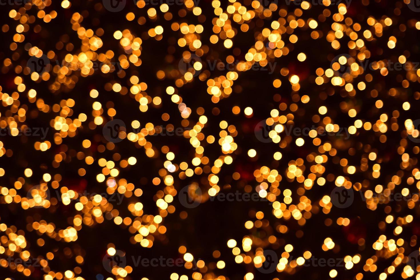 Gold bokeh circles on a black background. Christmas colorful lights. Overlay photo