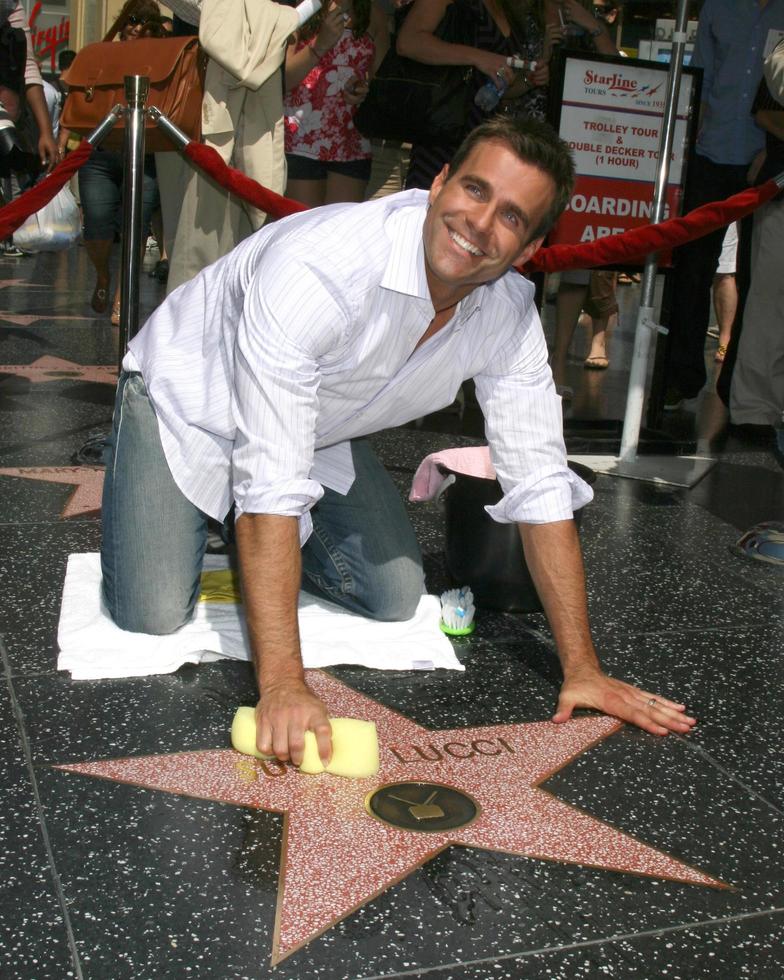 Cameron Mathison cleaning the Susan Lucci Star on the Hollywood Walk of Fame adjacent to the Kodak Theater piror to Daytime Emmys at the Hollywood and Highland complex in Hollywood, CA June 19, 2008 photo