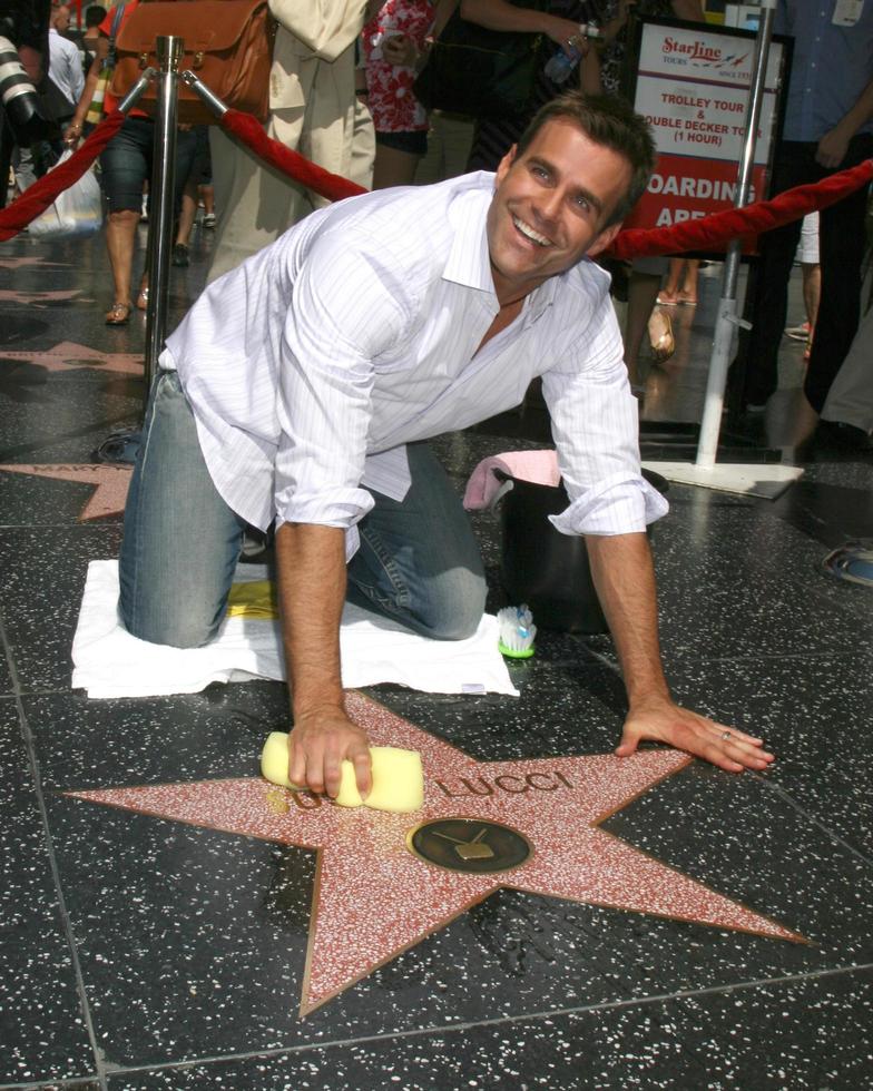 Cameron Mathison cleaning the Susan Lucci Star on the Hollywood Walk of Fame adjacent to the Kodak Theater piror to Daytime Emmys at the Hollywood and Highland complex in Hollywood, CA June 19, 2008 photo