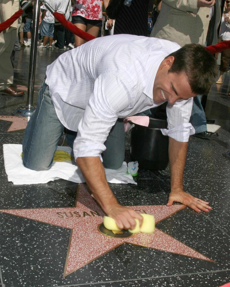Cameron Mathison cleaning the Susan Lucci Star on the Hollywood Walk of Fame adjacent to the Kodak Theater piror to Daytime Emmys at the Hollywood and Highland complex in Hollywood, CA June 19, 2008 photo