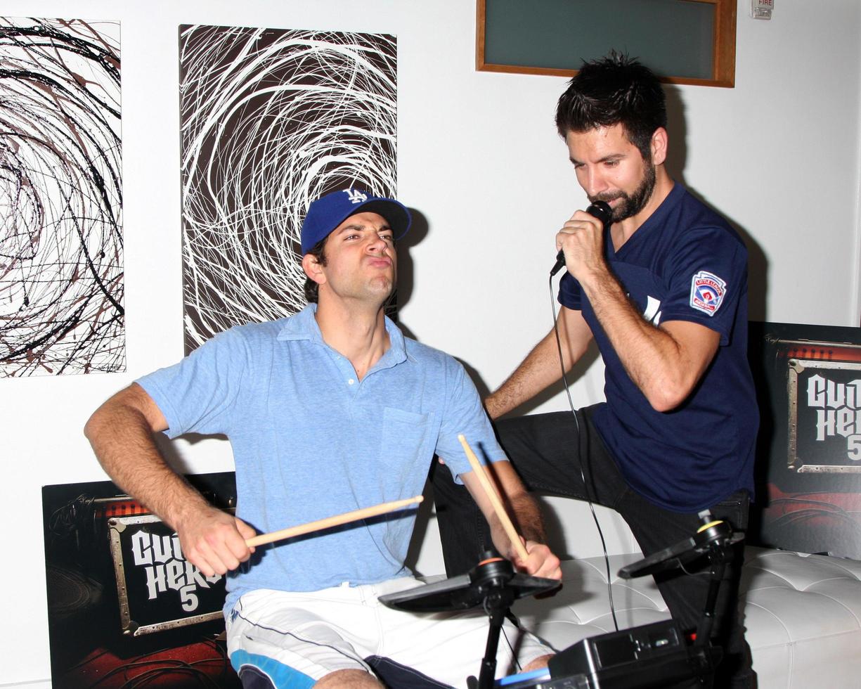 Zachary Levi and Joshua Gomez Chuck Kickoff party presented by Guitar Hero Five Roosevelt Hotel Pool Los Angeles, CA October 10, 2009 photo