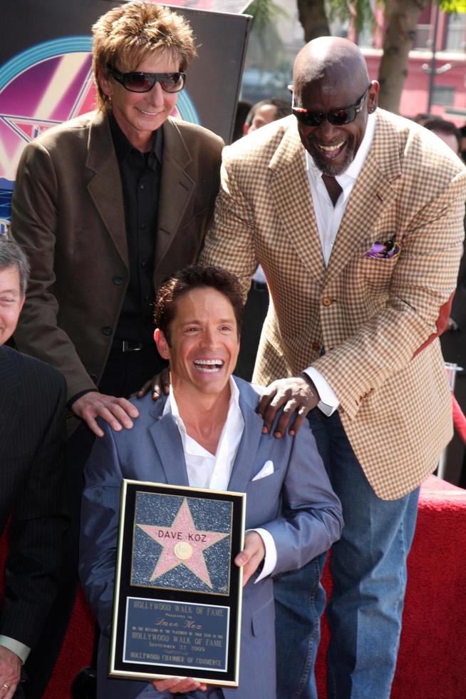 Barry Manilow, Chris Gardner and Dave Koz at the Hollywood Walk of Fame Star Ceremony honoring Dave Koz Capital Building in Hollywood Los Angeles, CA September 22, 2009 photo