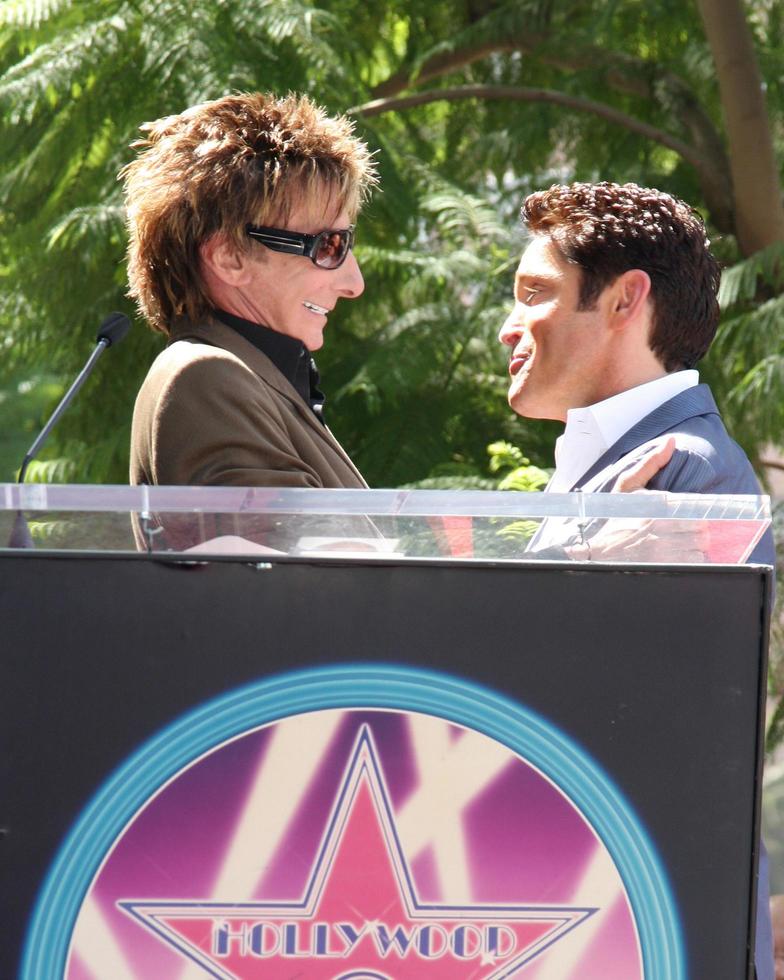 Barry Manilow and Dave Koz at the Hollywood Walk of Fame Star Ceremony honoring Dave Koz Capital Building in Hollywood Los Angeles, CA September 22, 2009 photo