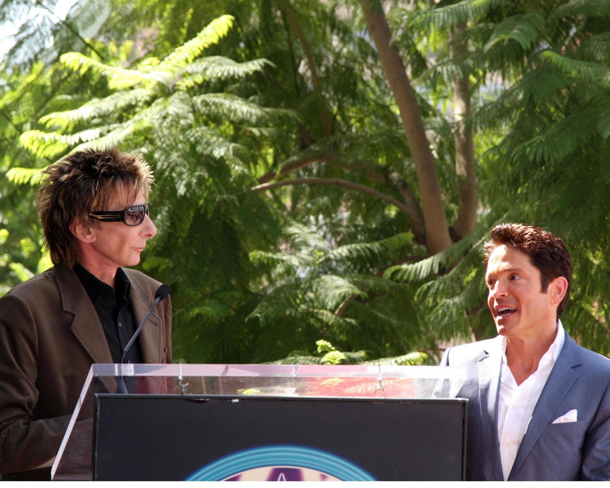 Barry Manilow and Dave Koz at the Hollywood Walk of Fame Star Ceremony honoring Dave Koz Capital Building in Hollywood Los Angeles, CA September 22, 2009 photo