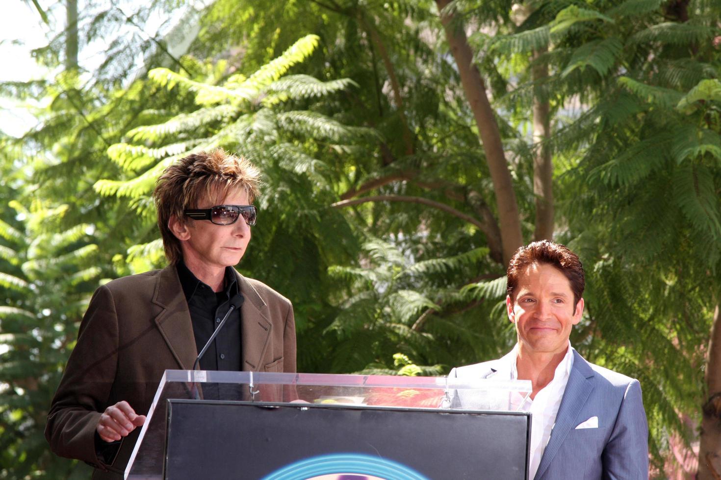 Barry Manilow and Dave Koz at the Hollywood Walk of Fame Star Ceremony honoring Dave Koz Capital Building in Hollywood Los Angeles, CA September 22, 2009 photo