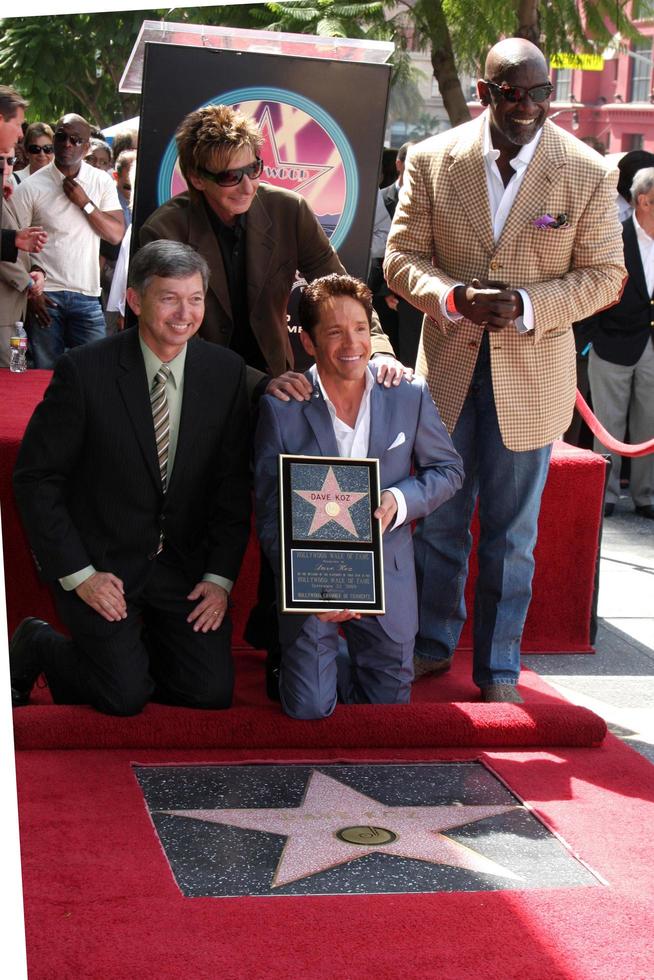 Leron Gubler, Barry Manilow, Chris Gardner and Dave Koz at the Hollywood Walk of Fame Star Ceremony honoring Dave Koz Capital Building in Hollywood Los Angeles, CA September 22, 2009 photo
